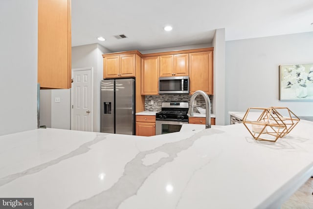 25 Kennedy Ct, Princeton, NJ 08540 - kitchen featuring stainless steel appliances, decorative backsplash, light stone counters, a sink, and recessed lighting
