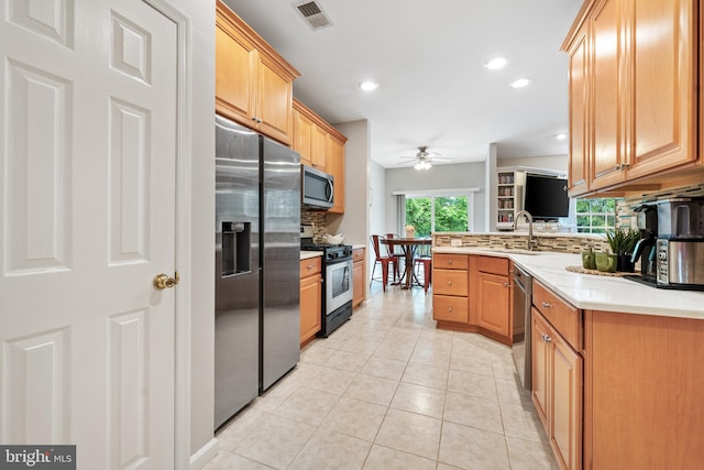25 Kennedy Ct, Princeton, NJ 08540 - kitchen featuring stainless steel appliances, a ceiling fan, backsplash, a sink, and light tile patterned floors