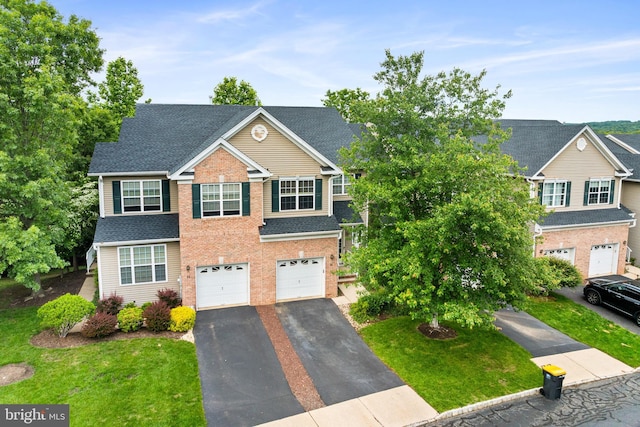 25 Kennedy Ct, Princeton, NJ 08540 - traditional-style house featuring a garage, driveway, brick siding, and a front lawn