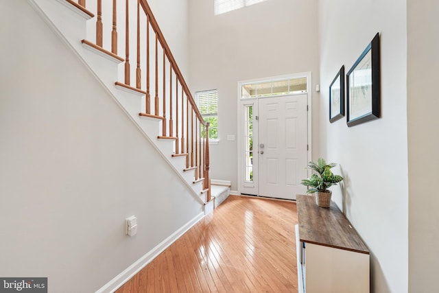 25 Kennedy Ct, Princeton, NJ 08540 - entrance foyer featuring light wood-type flooring, stairs, baseboards, and a towering ceiling
