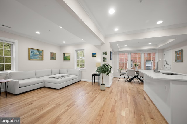 4700 Upton St NW Unit 3, Washington, DC 20016 - living area featuring crown molding, light wood-style flooring, healthy amount of natural light, recessed lighting, and baseboards