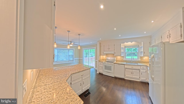 3204 Aquia Dr, Stafford, VA 22554 - kitchen with white appliances, a sink, white cabinetry, dark wood-type flooring, and light stone counters