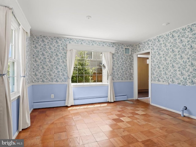 1229 7 Oaks Rd, Halethorpe, MD 21227 - unfurnished room featuring a baseboard heating unit, wallpapered walls, baseboards, and a wainscoted wall