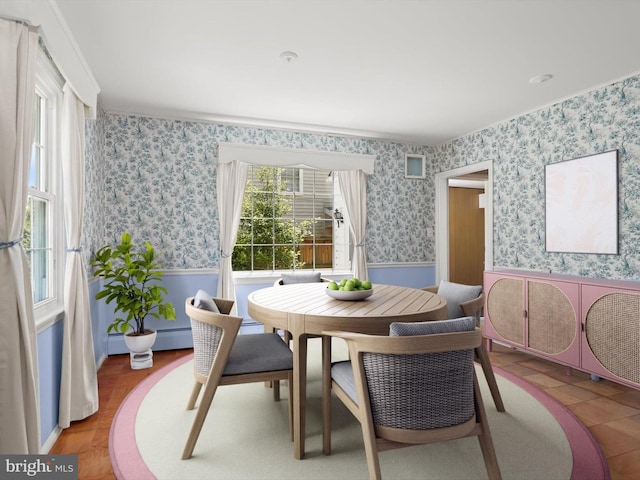 1229 7 Oaks Rd, Halethorpe, MD 21227 - dining room with wainscoting, wallpapered walls, and baseboard heating