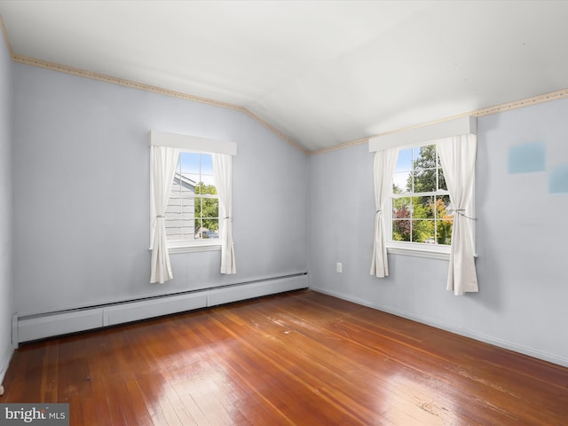 1229 7 Oaks Rd, Halethorpe, MD 21227 - spare room featuring a baseboard radiator, vaulted ceiling, plenty of natural light, hardwood / wood-style floors, and ornamental molding