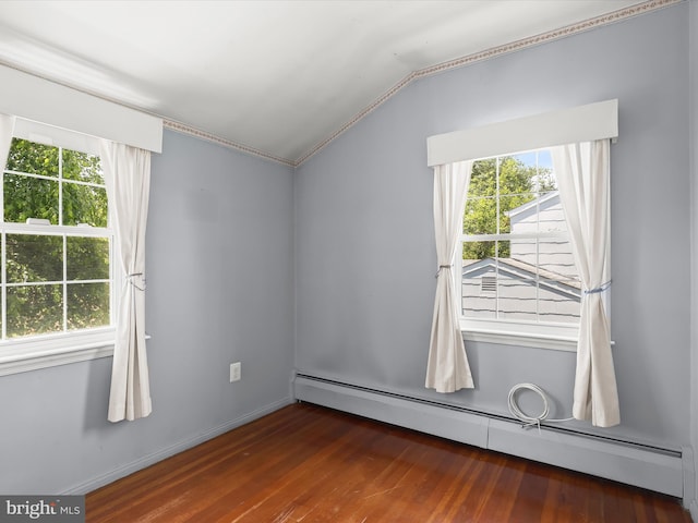 1229 7 Oaks Rd, Halethorpe, MD 21227 - spare room featuring a baseboard radiator, vaulted ceiling, plenty of natural light, and wood finished floors