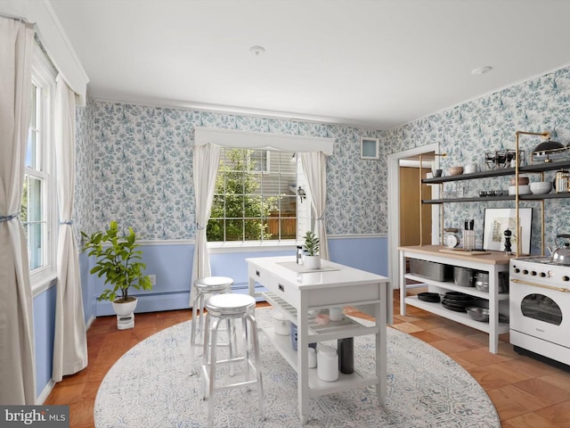 1229 7 Oaks Rd, Halethorpe, MD 21227 - dining area featuring wainscoting, wallpapered walls, and baseboard heating