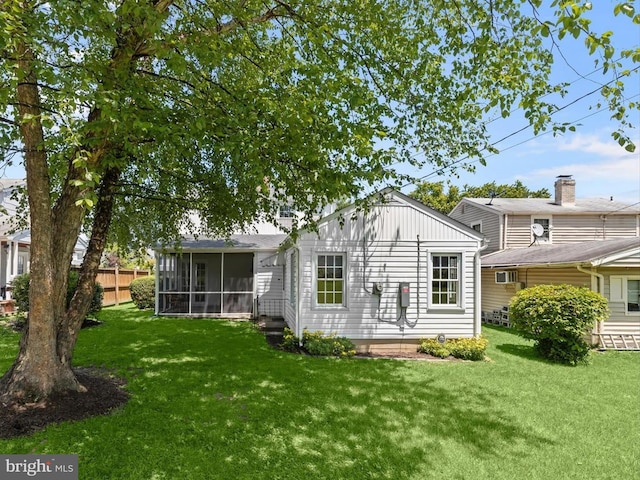 1229 7 Oaks Rd, Halethorpe, MD 21227 - back of property featuring a sunroom