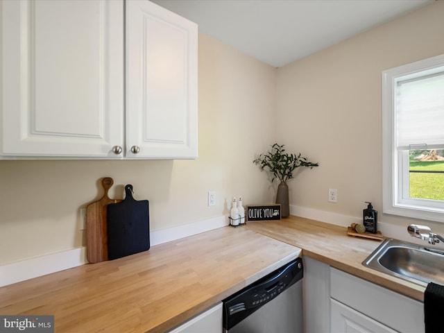 111 S Buchannan St, Ranson, WV 25438 - kitchen with wooden counters, stainless steel dishwasher, a sink, and white cabinets