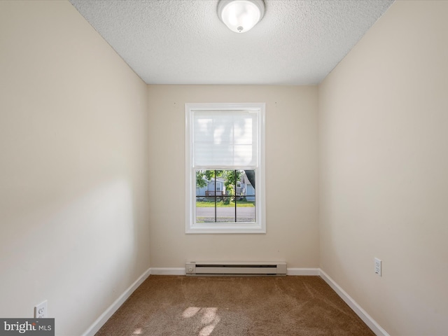 111 S Buchannan St, Ranson, WV 25438 - carpeted empty room featuring baseboard heating, a textured ceiling, and baseboards