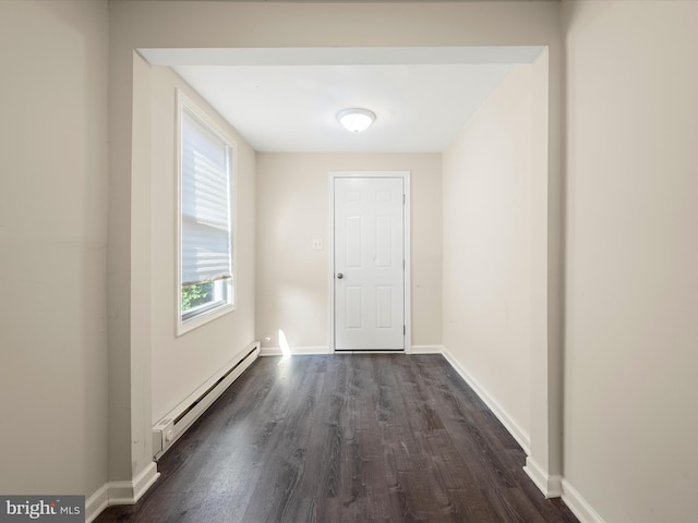 111 S Buchannan St, Ranson, WV 25438 - spare room featuring baseboard heating, dark wood-style floors, and baseboards