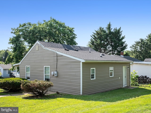 111 S Buchannan St, Ranson, WV 25438 - view of side of property featuring a lawn and a shingled roof