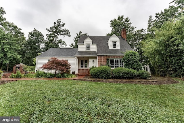 5632 Glenwood Dr, Alexandria, VA 22310 - cape cod house featuring brick siding, a front yard, and a chimney