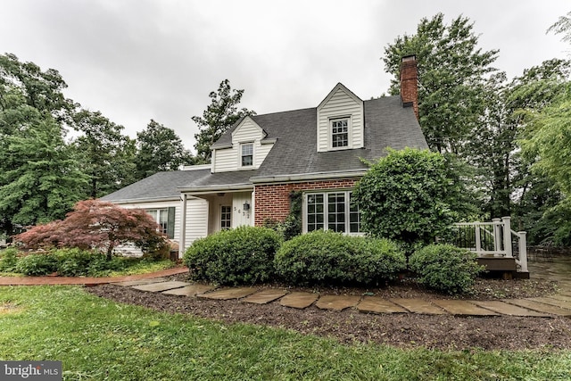 5632 Glenwood Dr, Alexandria, VA 22310 - cape cod home featuring a wooden deck, a chimney, and roof with shingles
