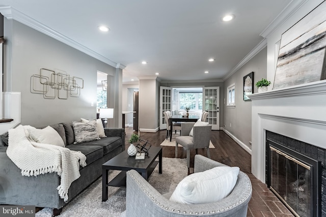 5632 Glenwood Dr, Alexandria, VA 22310 - living area with a glass covered fireplace, recessed lighting, ornamental molding, and dark wood-style floors