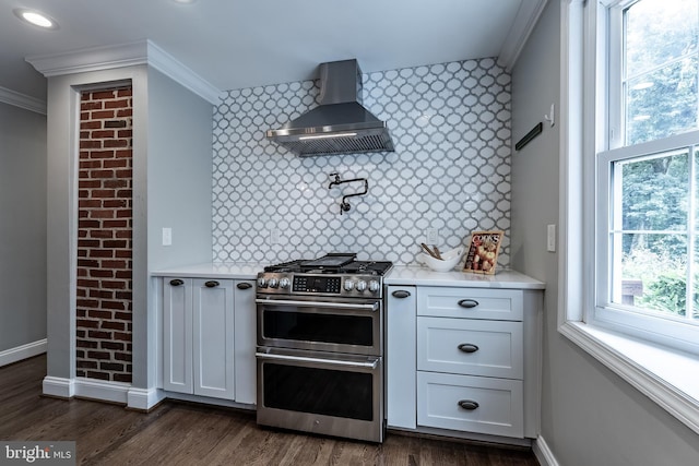 5632 Glenwood Dr, Alexandria, VA 22310 - kitchen featuring double oven range, wall chimney range hood, crown molding, light countertops, and dark wood-style floors
