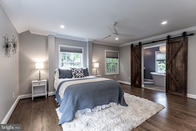 5632 Glenwood Dr, Alexandria, VA 22310 - bedroom featuring a barn door, multiple windows, ornamental molding, wood finished floors, and recessed lighting