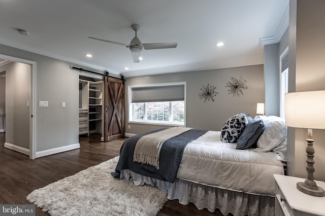 5632 Glenwood Dr, Alexandria, VA 22310 - bedroom with a barn door, crown molding, recessed lighting, wood finished floors, and ceiling fan
