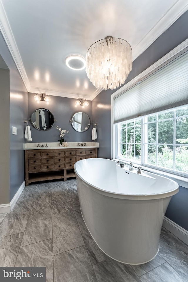5632 Glenwood Dr, Alexandria, VA 22310 - bathroom with ornamental molding, double vanity, a freestanding tub, marble look tile flooring, and a chandelier