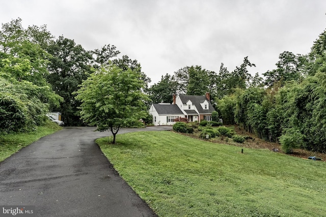 5632 Glenwood Dr, Alexandria, VA 22310 - cape cod home featuring driveway, a front yard, and a chimney