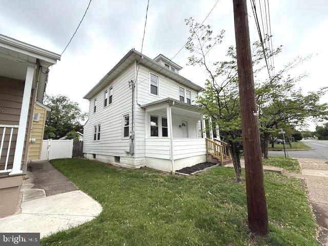 2222 Spruce St, Ewing, NJ 08638 - view of side of home featuring a yard