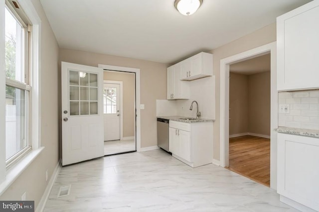 2222 Spruce St, Ewing, NJ 08638 - kitchen with dishwasher, a sink, light stone countertops, and white cabinets