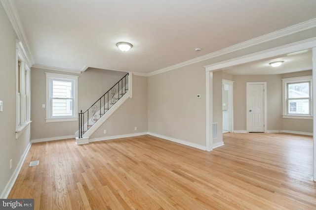 2222 Spruce St, Ewing, NJ 08638 - unfurnished living room with light wood-style floors, crown molding, baseboards, plenty of natural light, and stairs