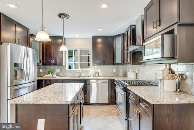 1812 N Culpeper St, Arlington, VA 22207 - kitchen with stainless steel appliances, dark brown cabinets, a sink, backsplash, and recessed lighting