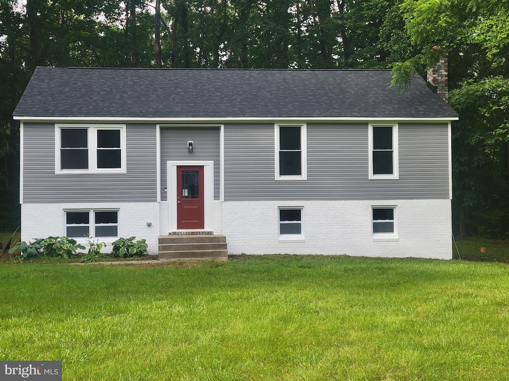 5311 Cove View Dr, Saint Leonard, MD 20685 - bi-level home featuring entry steps, a front lawn, a chimney, and brick siding
