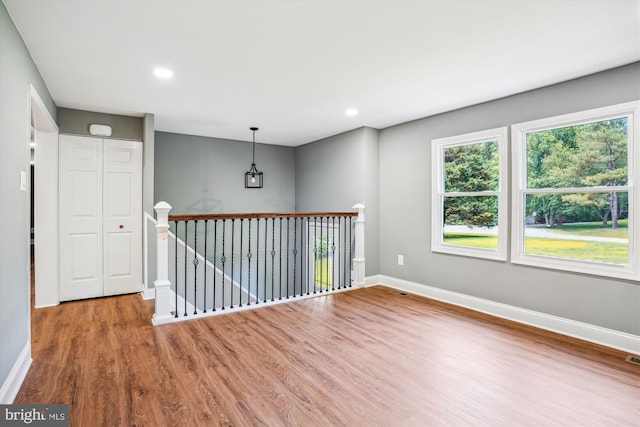 5311 Cove View Dr, Saint Leonard, MD 20685 - unfurnished room featuring baseboards, wood finished floors, healthy amount of natural light, and recessed lighting