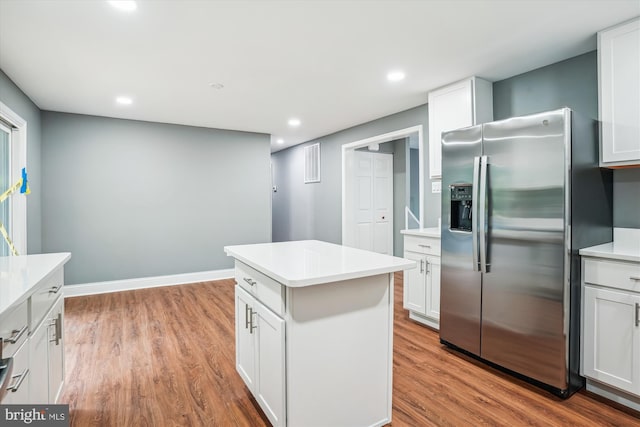 5311 Cove View Dr, Saint Leonard, MD 20685 - kitchen featuring stainless steel fridge, wood finished floors, a center island, light countertops, and recessed lighting
