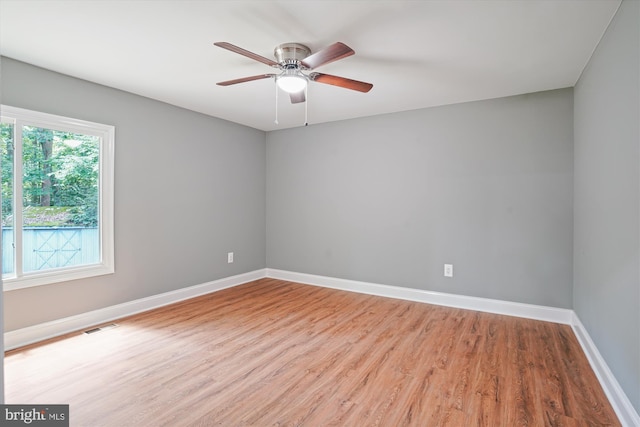 5311 Cove View Dr, Saint Leonard, MD 20685 - empty room featuring wood finished floors, baseboards, and a ceiling fan