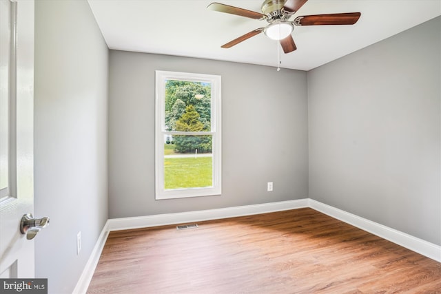 5311 Cove View Dr, Saint Leonard, MD 20685 - empty room with wood finished floors, a ceiling fan, and baseboards
