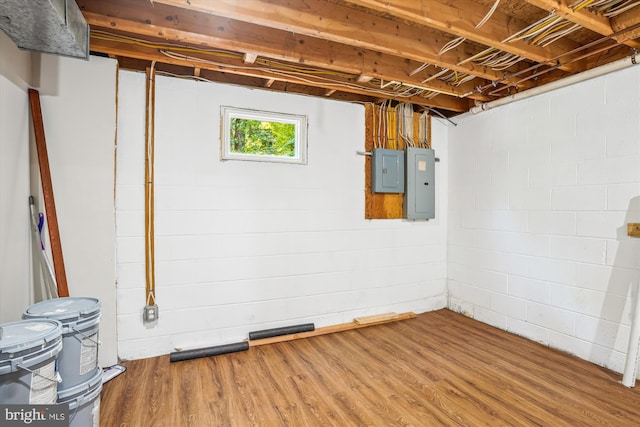 5311 Cove View Dr, Saint Leonard, MD 20685 - basement with electric panel, wood finished floors, and concrete block wall