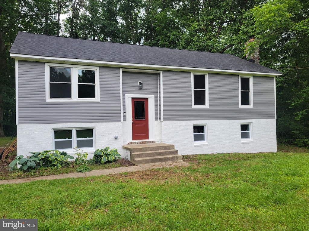 5311 Cove View Dr, Saint Leonard, MD 20685 - raised ranch featuring entry steps, a chimney, a front lawn, and brick siding