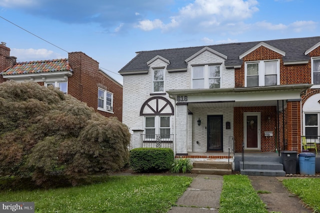 616 New Holland Ave, Lancaster, PA 17602 - view of front facade with brick siding and covered porch