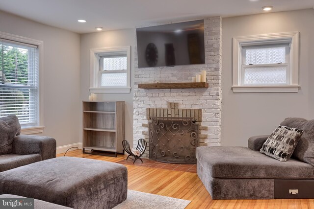616 New Holland Ave, Lancaster, PA 17602 - living area featuring a brick fireplace, wood finished floors, and recessed lighting
