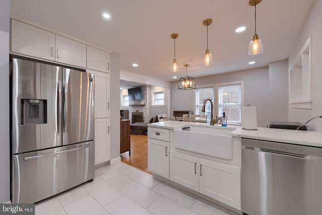 616 New Holland Ave, Lancaster, PA 17602 - kitchen with stainless steel appliances, white cabinetry, recessed lighting, open floor plan, and light tile patterned floors
