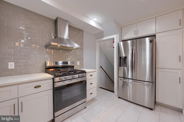 616 New Holland Ave, Lancaster, PA 17602 - kitchen with appliances with stainless steel finishes, wall chimney range hood, backsplash, white cabinets, and recessed lighting