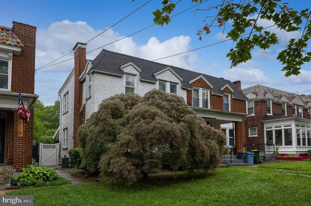 616 New Holland Ave, Lancaster, PA 17602 - view of property exterior featuring brick siding, a gate, and a lawn