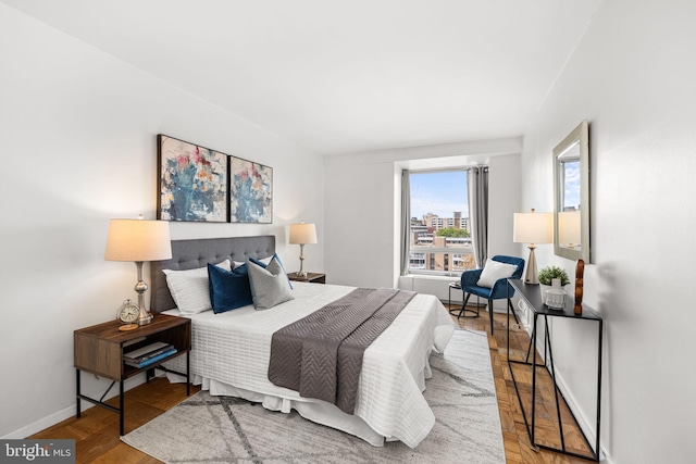 1435 4th St SW Unit B513, Washington, DC 20024 - bedroom featuring baseboards and wood finished floors