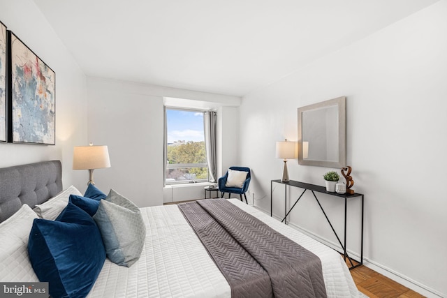 1435 4th St SW Unit B513, Washington, DC 20024 - bedroom featuring baseboards and wood finished floors