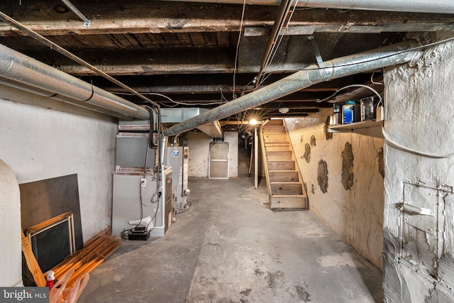 1240 Wall St, Baltimore, MD 21230 - unfinished below grade area featuring gas water heater, stairs, and heating unit