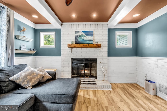 20 Elkshead Ter, Hamilton, NJ 08620 - living area featuring beamed ceiling, wainscoting, wood finished floors, and a fireplace