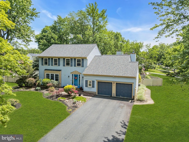 20 Elkshead Ter, Hamilton, NJ 08620 - colonial-style house with a garage, driveway, a chimney, and roof with shingles