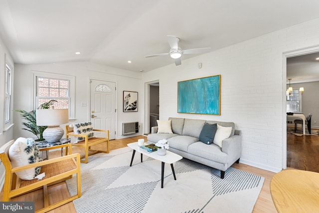 1604 Crittenden St NE, Washington, DC 20017 - living area with wood finished floors, vaulted ceiling, ceiling fan, and a chandelier