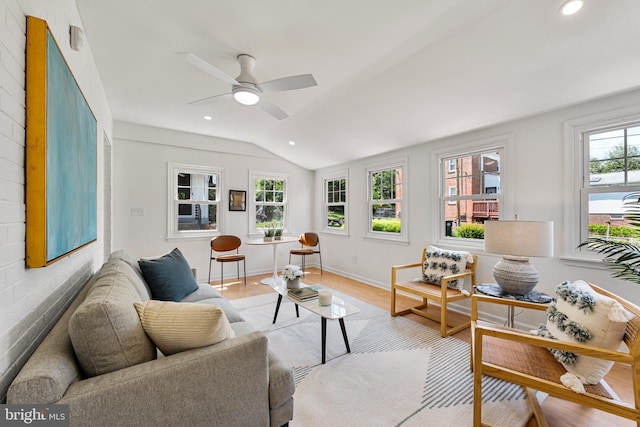 1604 Crittenden St NE, Washington, DC 20017 - living room featuring lofted ceiling, wood finished floors, ceiling fan, recessed lighting, and baseboards
