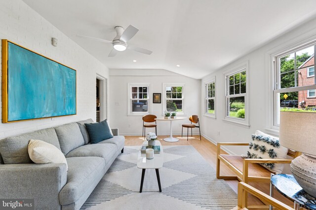 1604 Crittenden St NE, Washington, DC 20017 - living room featuring lofted ceiling, a ceiling fan, light wood-style flooring, and baseboards