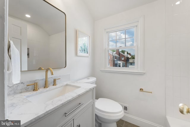 1604 Crittenden St NE, Washington, DC 20017 - full bathroom with toilet, vanity, and vaulted ceiling