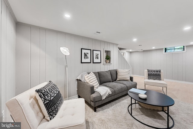 1604 Crittenden St NE, Washington, DC 20017 - living room with stairs, recessed lighting, wood finished floors, and a decorative wall